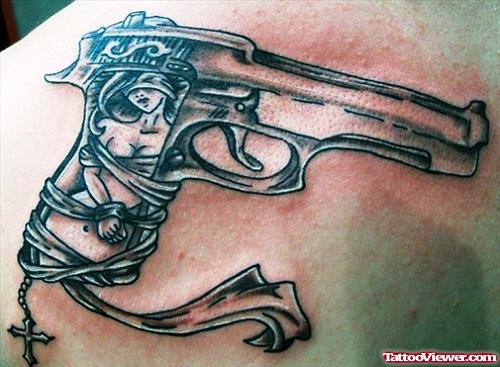 Grey Ink Gun With Rosary Tattoo
