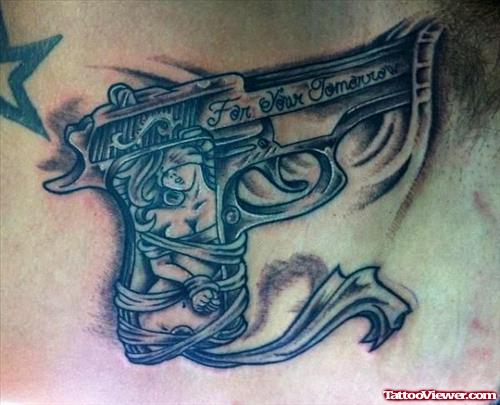 Grey Ink Gun Tattoo On Man Chest