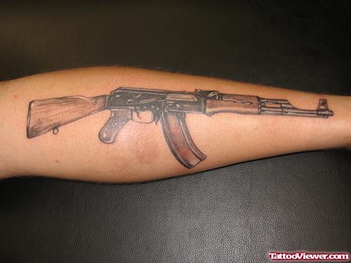 Grey Ink Ak47 Gun Tattoo On Leg