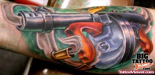 Colored Gun Tattoo On Left Arm