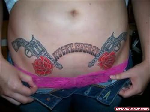 Roses And Gun Tattoos On Stomach