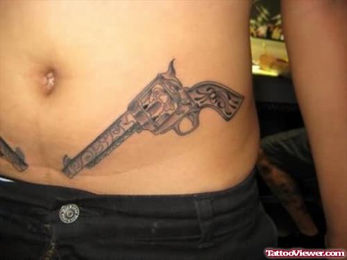 Lower Waist Gun Tattoos