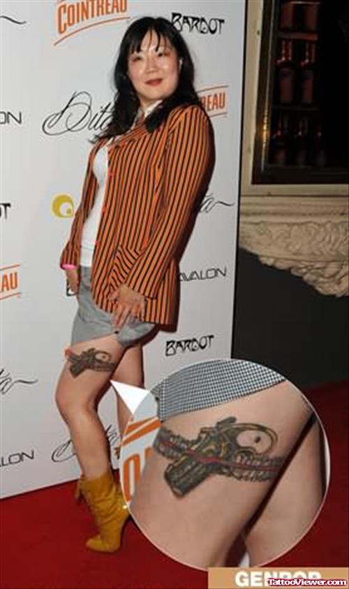 Gun Tattoo On Girl Thigh