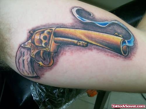 Golden Gun Tattoo On Arm