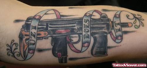 Black Ink Gun Tattoo On Arm