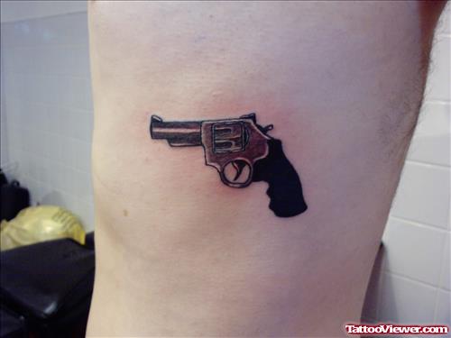 Small Gun Tattoo On Body