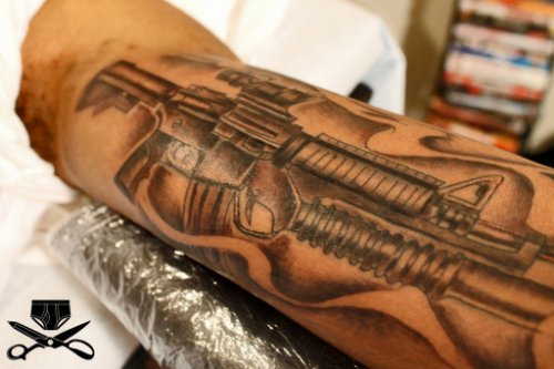 Amazing Grey Ink Gun Tattoo On Full Arm