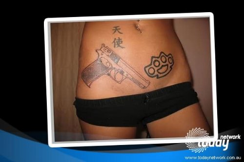 Chinese Symbols And Gun Tattoo