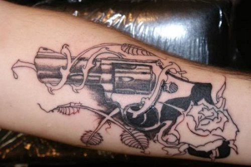 Gun Tattoo With Vine Flowers