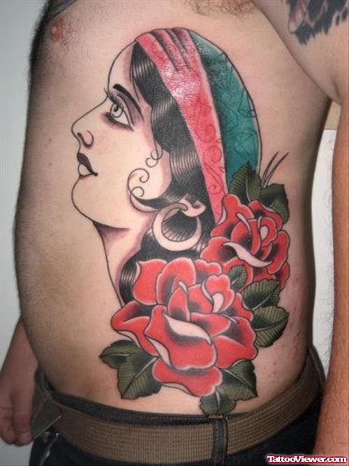 Red Flowers And Gypsy Tattoo On Man Side Rib