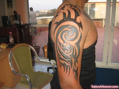 Awful Black Ink Tribal Half Sleeve Tattoo For Men