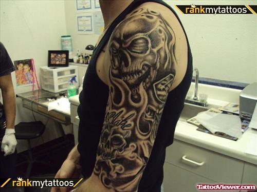 Dark Ink Skull Half Sleeve Tattoo