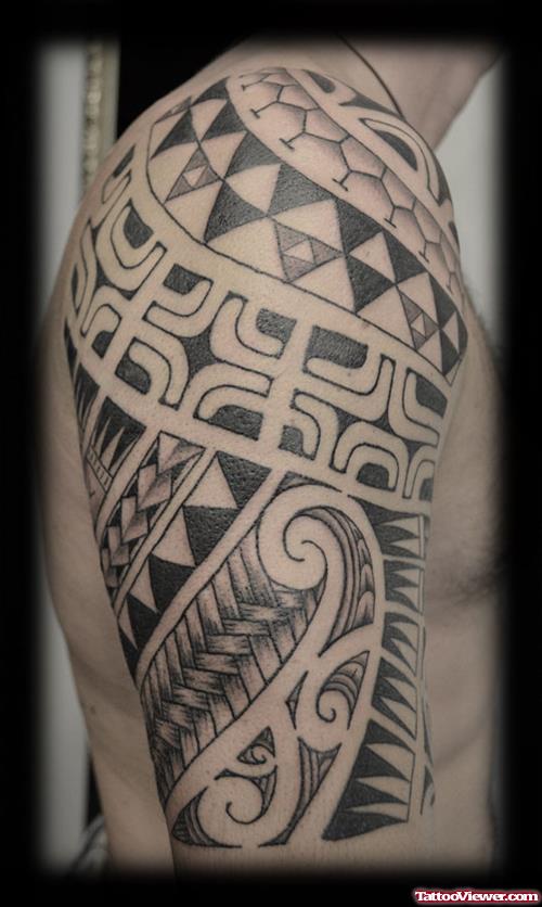 Attractive Black Ink Maori Half Sleeve Tattoo