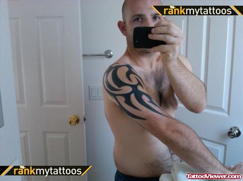 Man Showing His Half Sleeve Tattoo