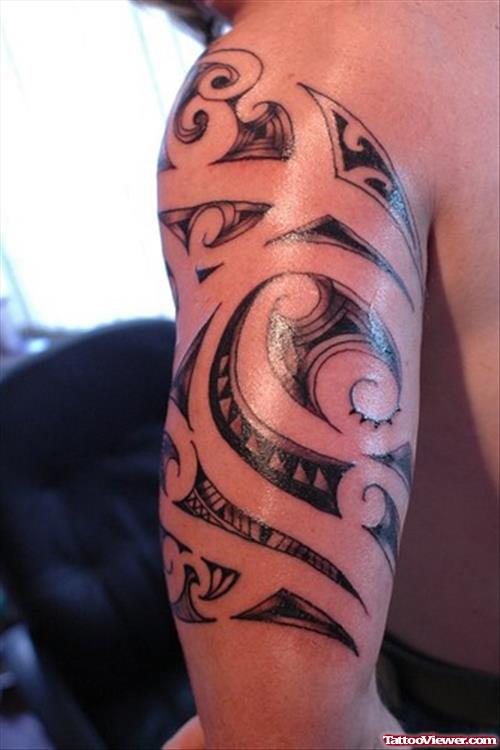 Black Ink Maori Tribal Left Half Sleeve Tattoo