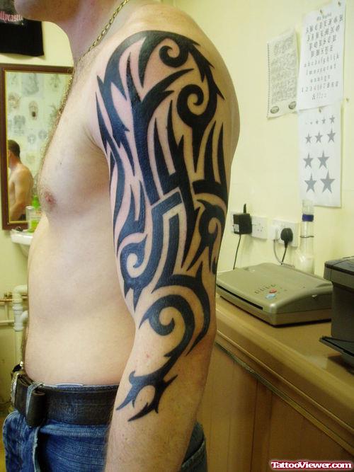 Amazing Black Tribal Left Half Sleeve Tattoo
