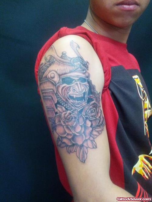 Grey Rose Flowers And Skull Half Sleeve Tattoo
