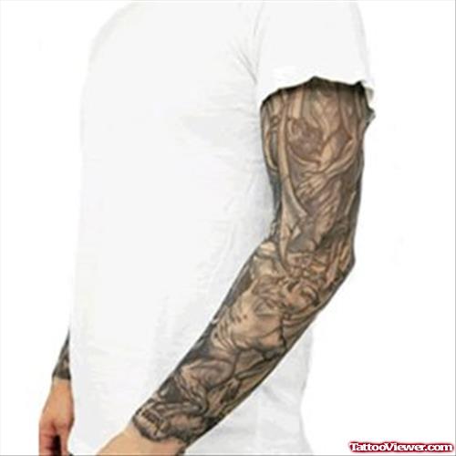 Grey Ink Scary Tattoo On Man Half Sleeve