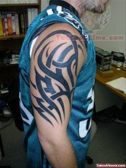 Tribal Half Sleeve Tattoo On Bicep