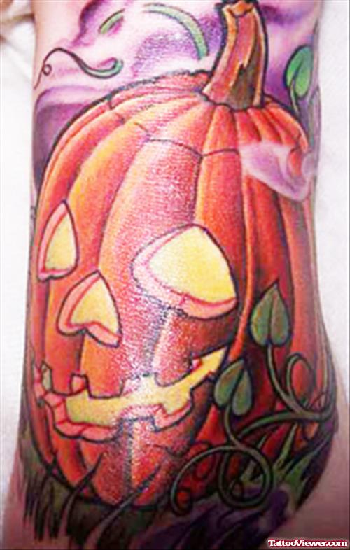 Beautiful Colored Halloween Pumpkin Tattoo