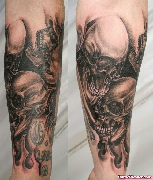 Grey Ink Skull and Halloween Tattoo On Sleeve