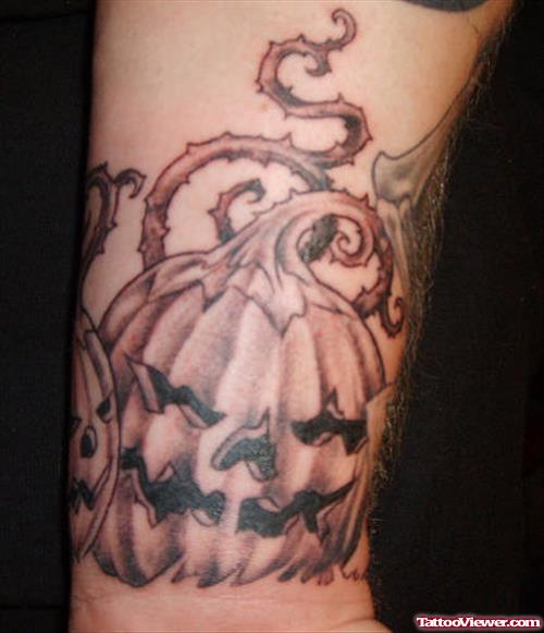 Grey Ink Halloween Pumpkin Tattoo