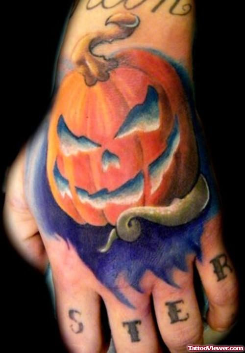Colored Halloween Pumpkin Tattoo On Left Hand