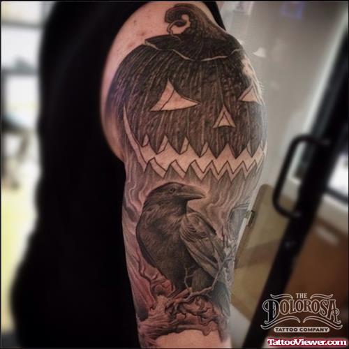 Grey Ink Crow And Halloween Pumpkin Tattoo On Right Sleeve
