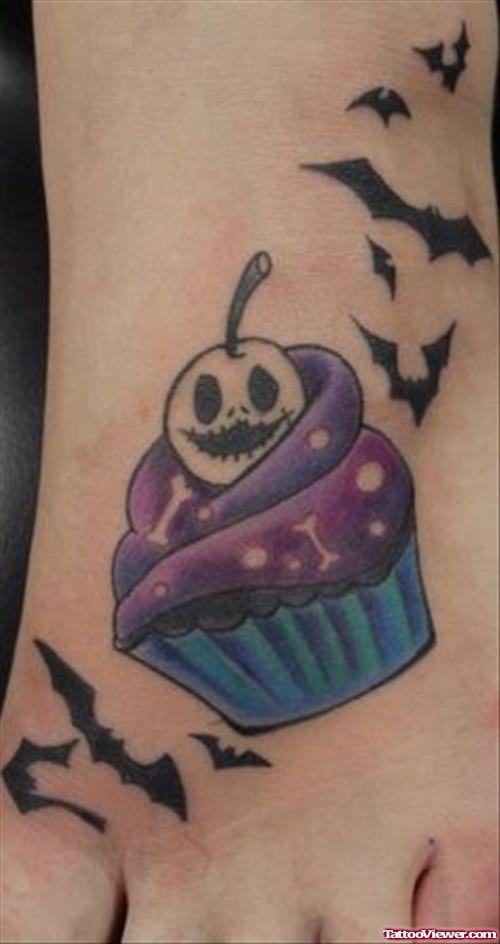 Flying Bats And Cupake Halloween Tattoo On Left Foot