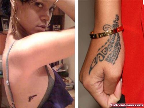 Rihanna With Gun And Tribal Hand Tattoo