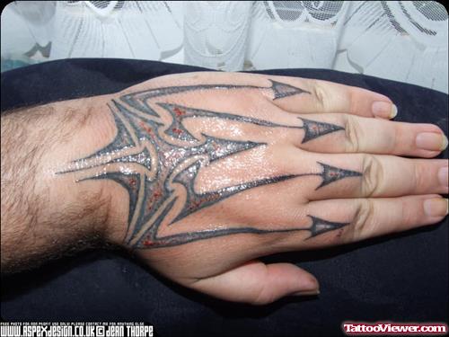 Grey Ink Tribal Hand Tattoo