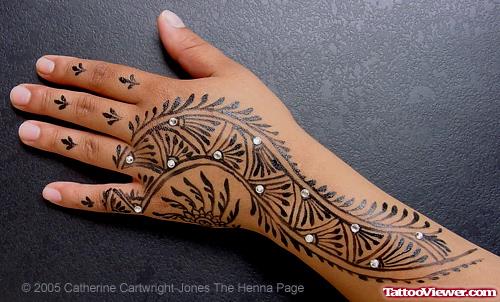 Black Tribal Hand Tattoo On Girl Left Hand