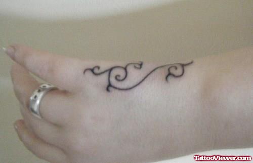Black Ink Swirl Hand Tattoo For Girls