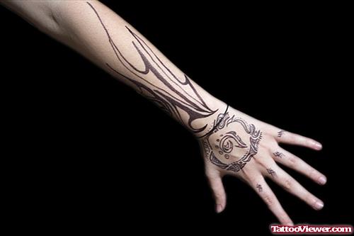 Grey Ink Tribal Left Hand Tattoo