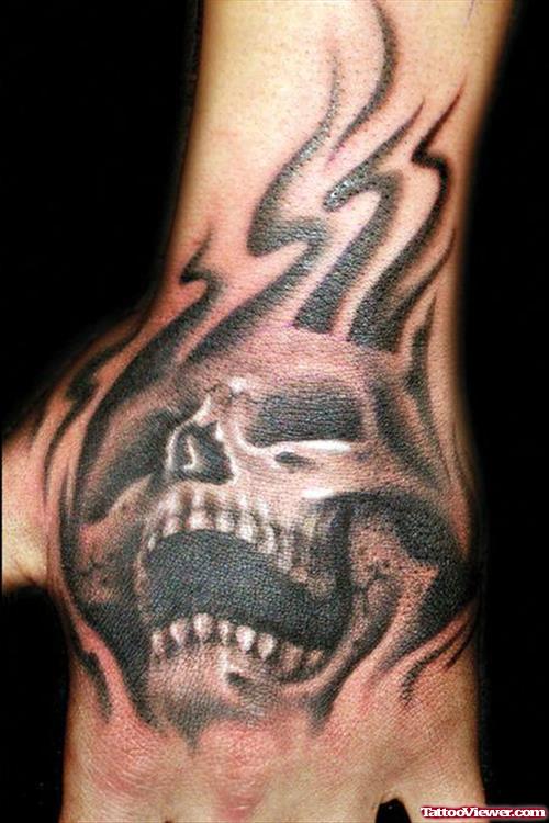 Tribal And Skull Hand Tattoo