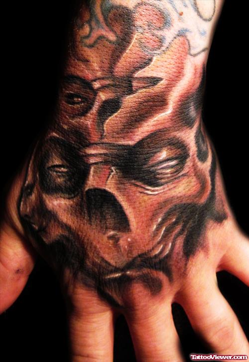 Grey Ink Skull Hand Tattoo