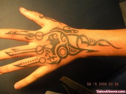 Beautiful Black Ink Tribal Hand Tattoo