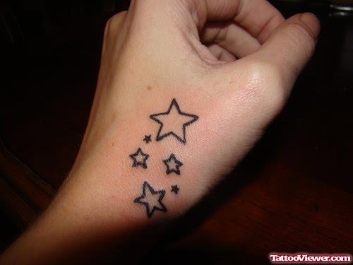 Outline Stars Hand Tattoo