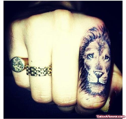 Grey Ink Lion Head Hand Tattoo