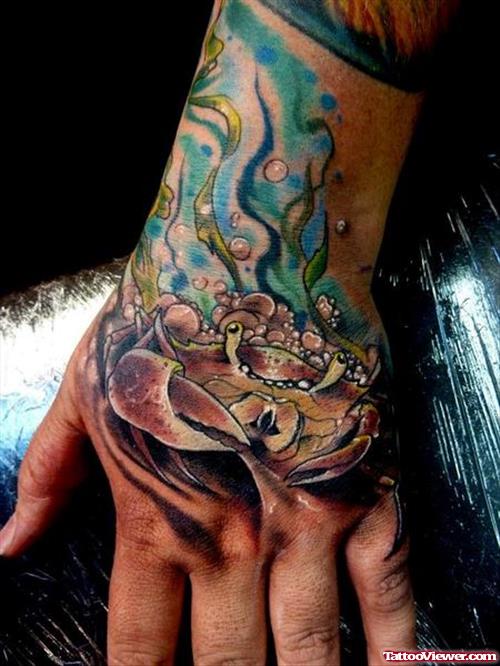 Brown Ink Crab Hand Tattoo