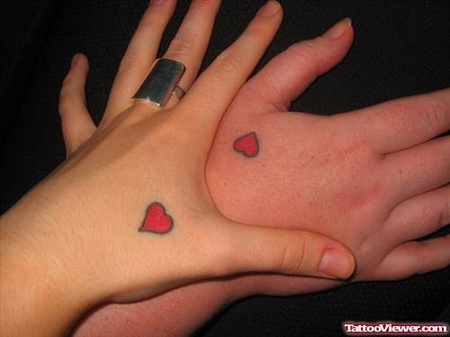 Small Red Hearts Hand Tattoos