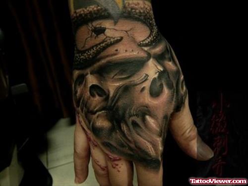 Grey Ink Scary Skull Hand Tattoo