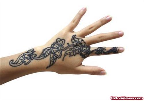 Black Ink Leaves Hand Tattoo