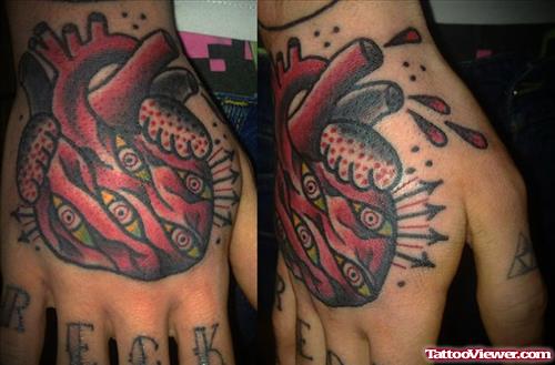 Colored Human Heart Hand Tattoo