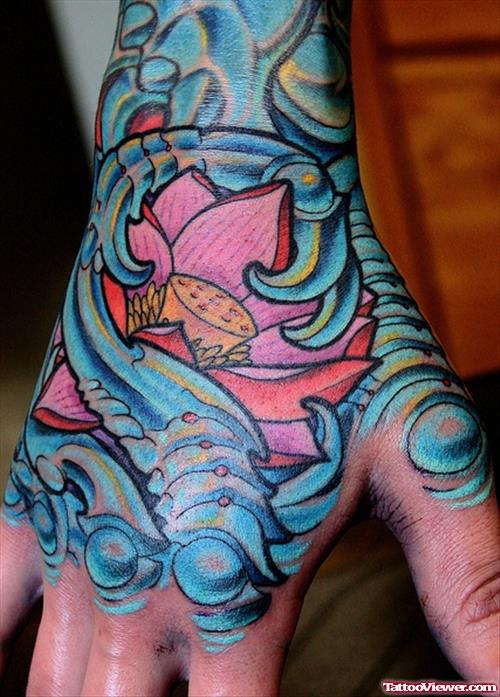 Colored Biomechanical Hand Tattoo