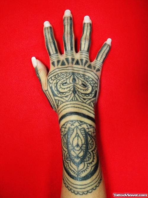 Grey Ink Tribal Tattoo On Right Hand
