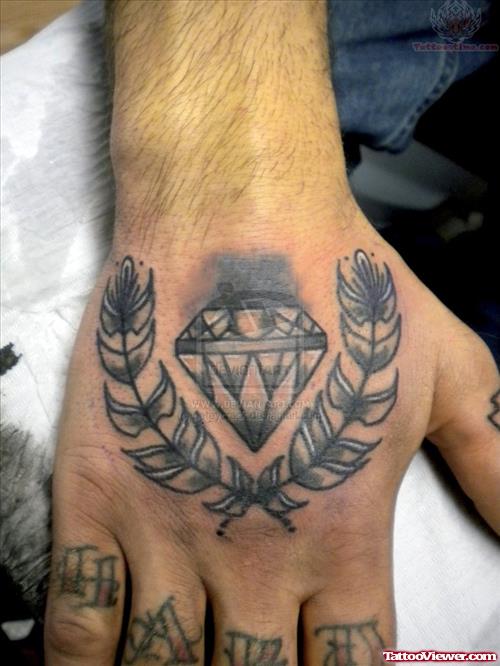 Grey Ink Leafs And Diamond Hand Tattoo On Hand