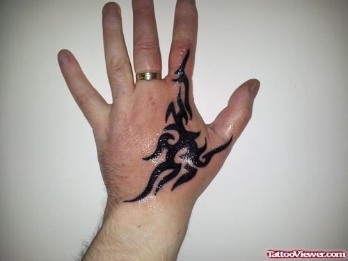 Black Tribal Left Hand Tattoo