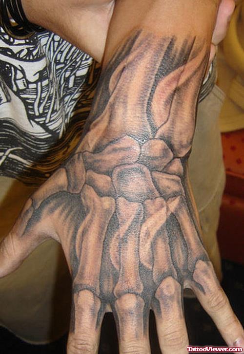 Amazing Grey Ink Hand Skeleton Tattoo