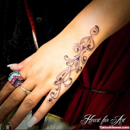 Swirl Tattoo On Girl Left Hand